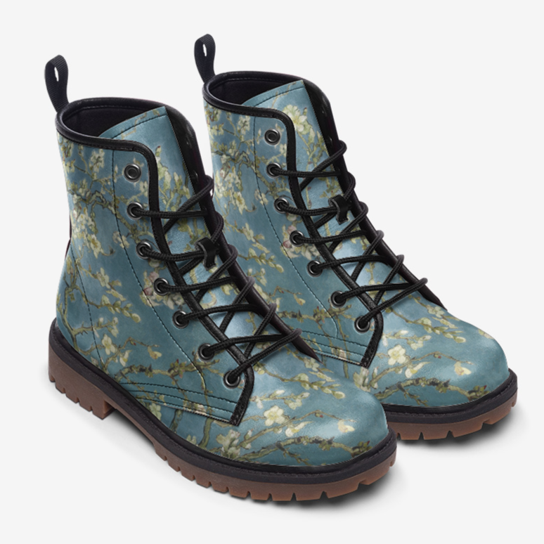a pair of blue boots with flowers on them