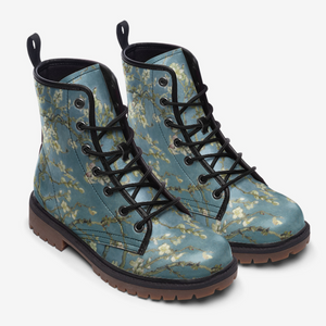 a pair of blue boots with flowers on them
