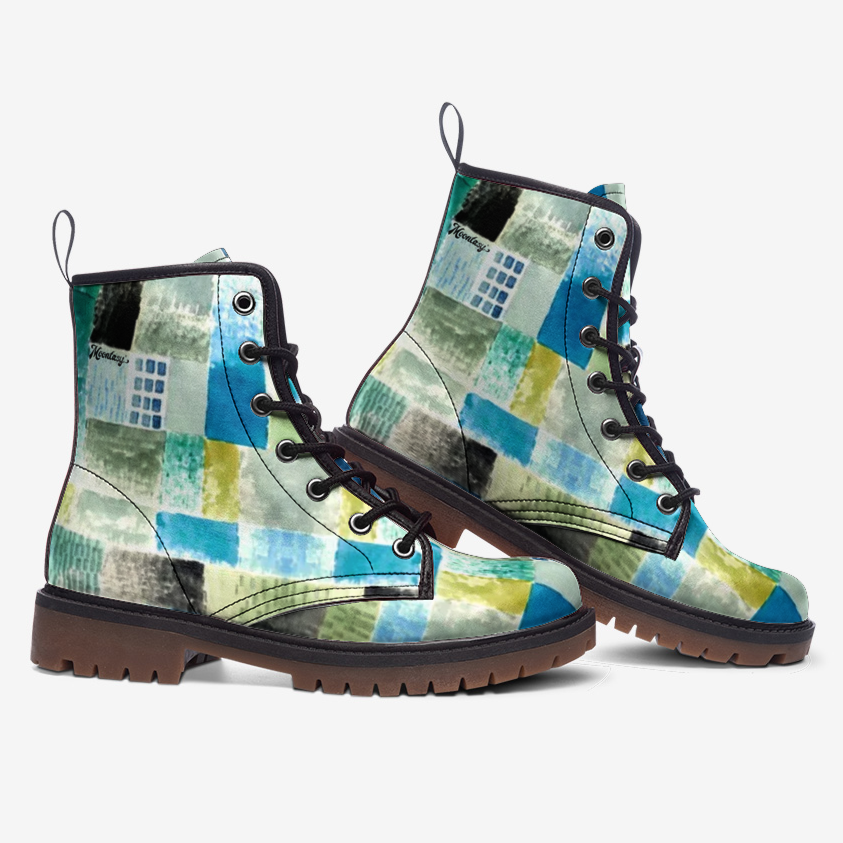 a pair of blue and green boots on a white background