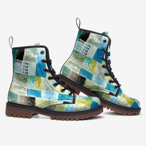 a pair of blue and green boots on a white background