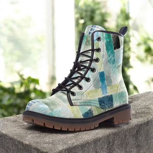 a close up of a pair of boots on a ledge
