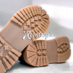 a close up of a pair of shoes on a table
