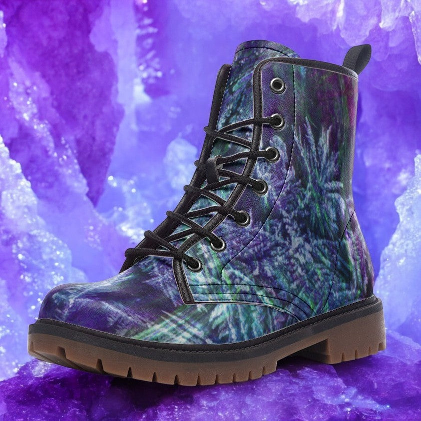 a close up of a pair of boots on a purple background