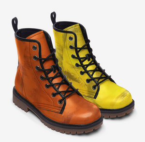 a pair of yellow and orange boots on a white background