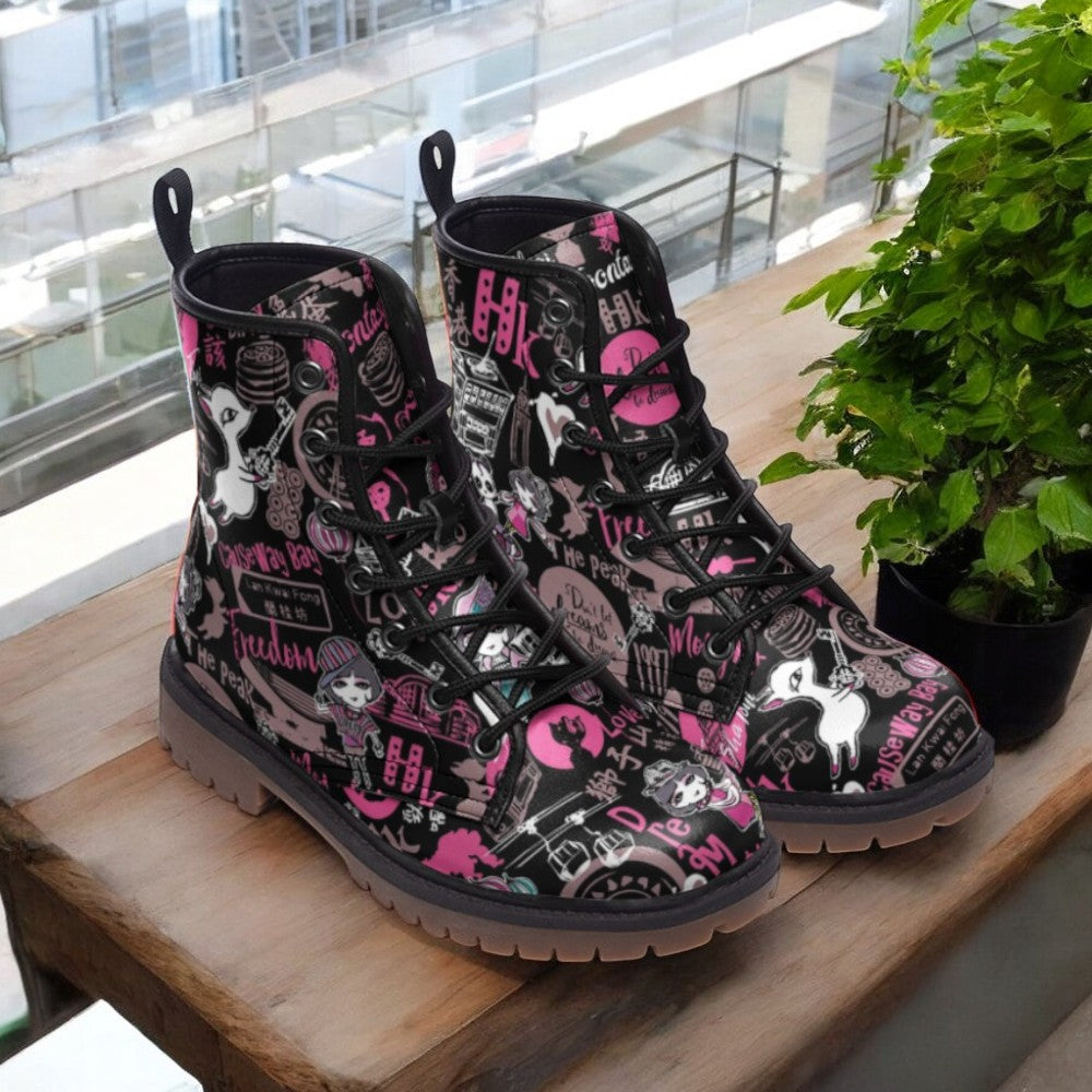 a pair of black and pink boots sitting on top of a wooden table