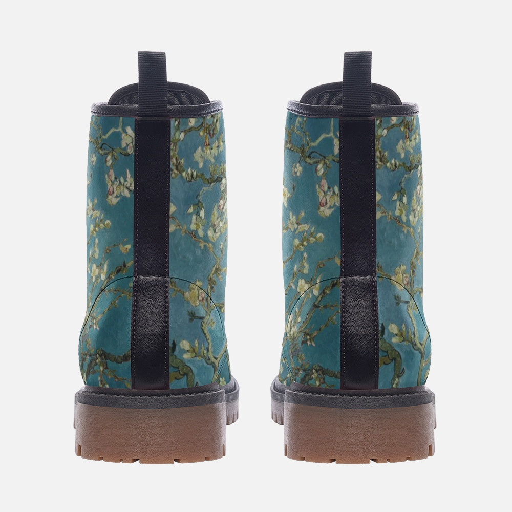 a pair of blue boots with flowers on them
