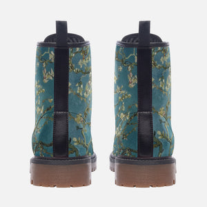 a pair of blue boots with flowers on them
