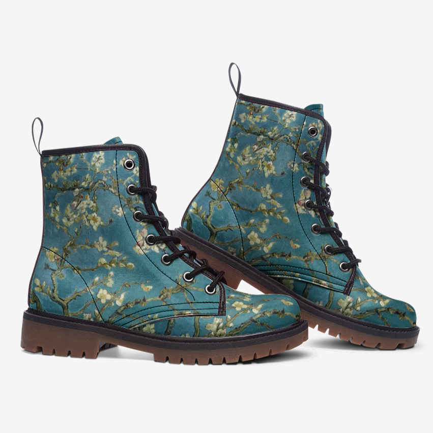 a pair of blue boots with flowers on them