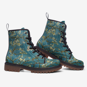 a pair of blue boots with flowers on them