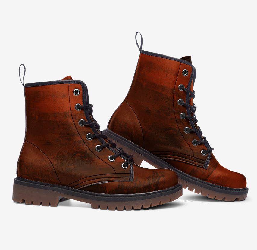 a pair of brown boots on a white background