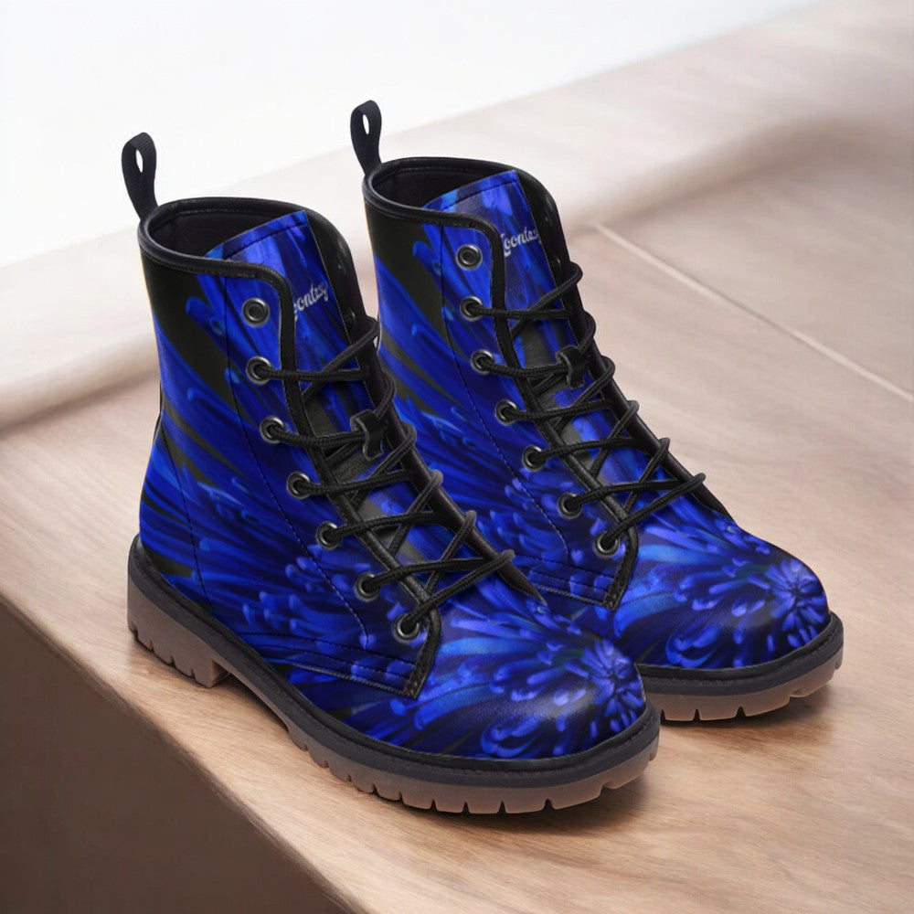 a pair of blue boots sitting on top of a wooden table