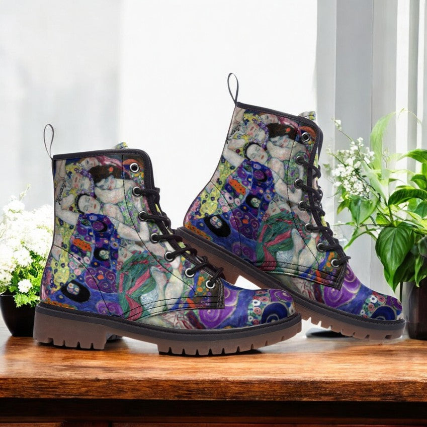 a pair of colorful boots sitting on top of a wooden table