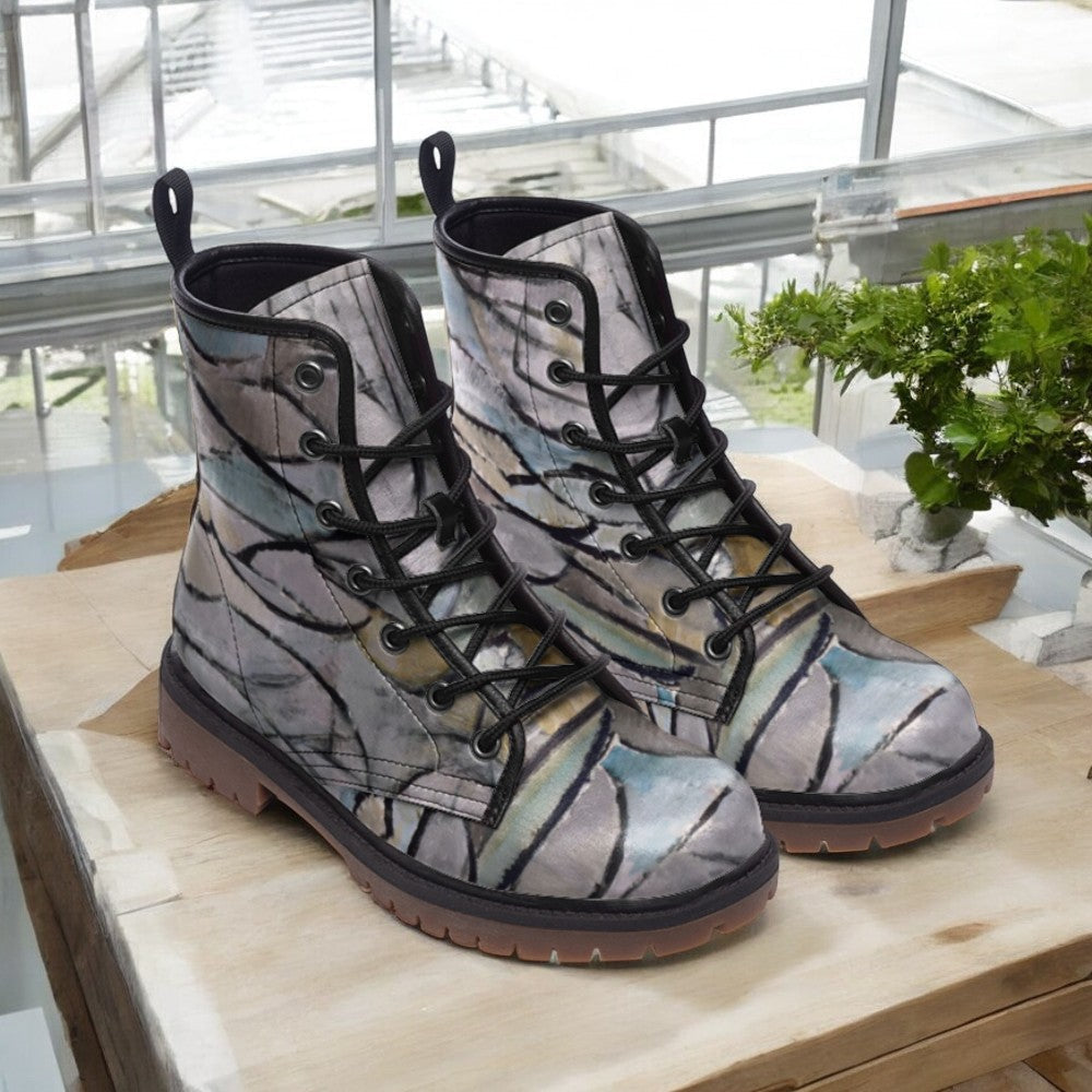 a pair of boots sitting on top of a wooden table