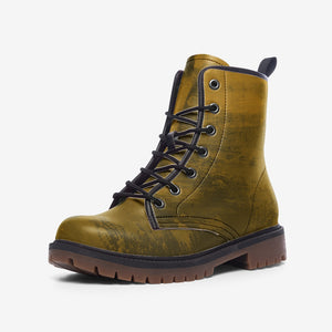 a pair of yellow boots with black laces