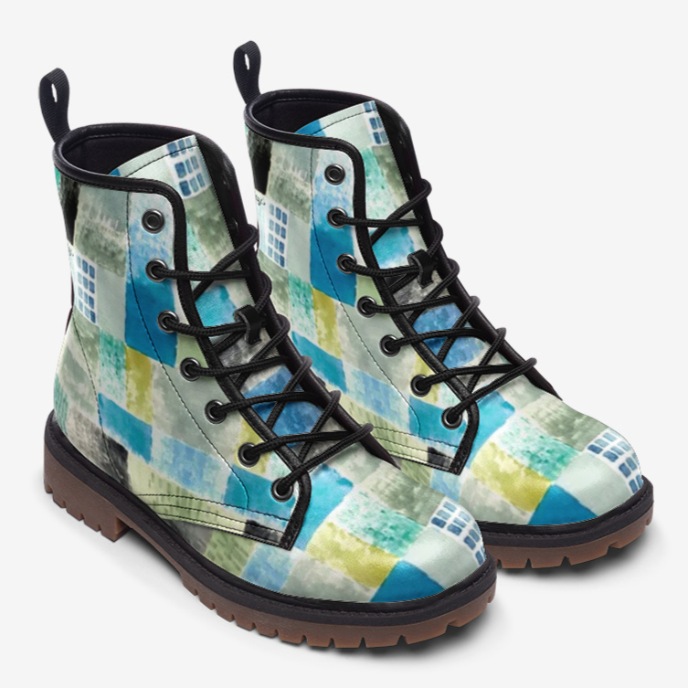 a pair of blue and yellow boots on a white background