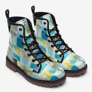 a pair of blue and yellow boots on a white background