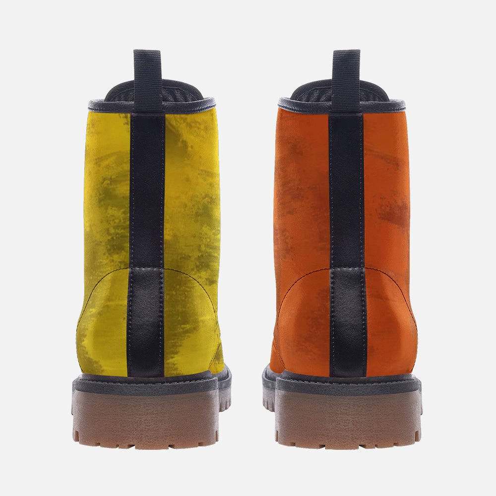 a pair of yellow and orange boots on a white background