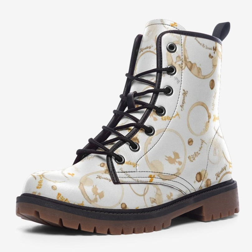 a pair of white and brown boots with black laces
