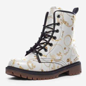 a pair of white and brown boots with black laces