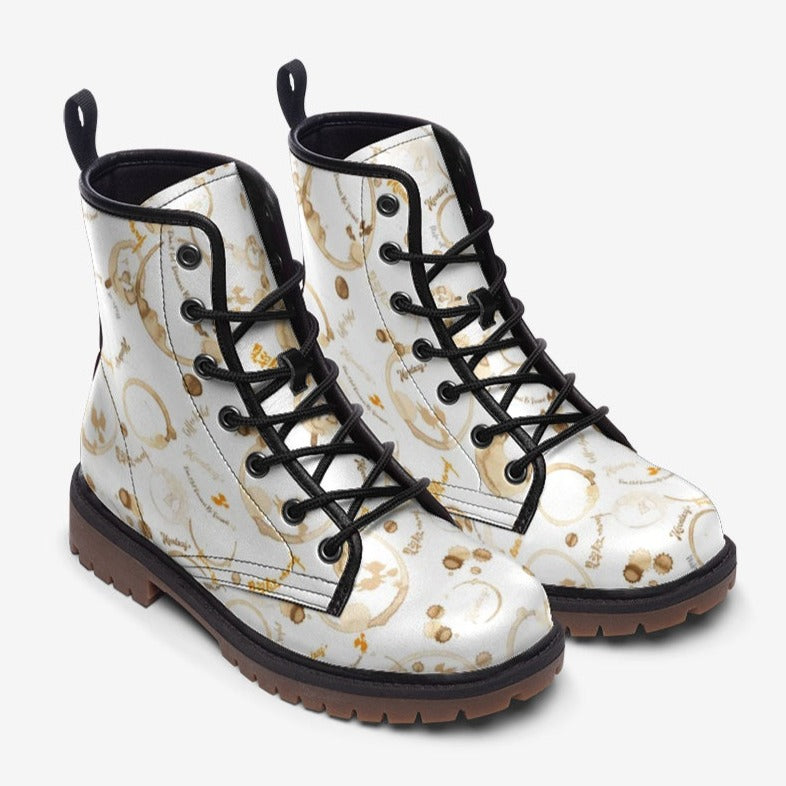 a pair of white boots with black laces