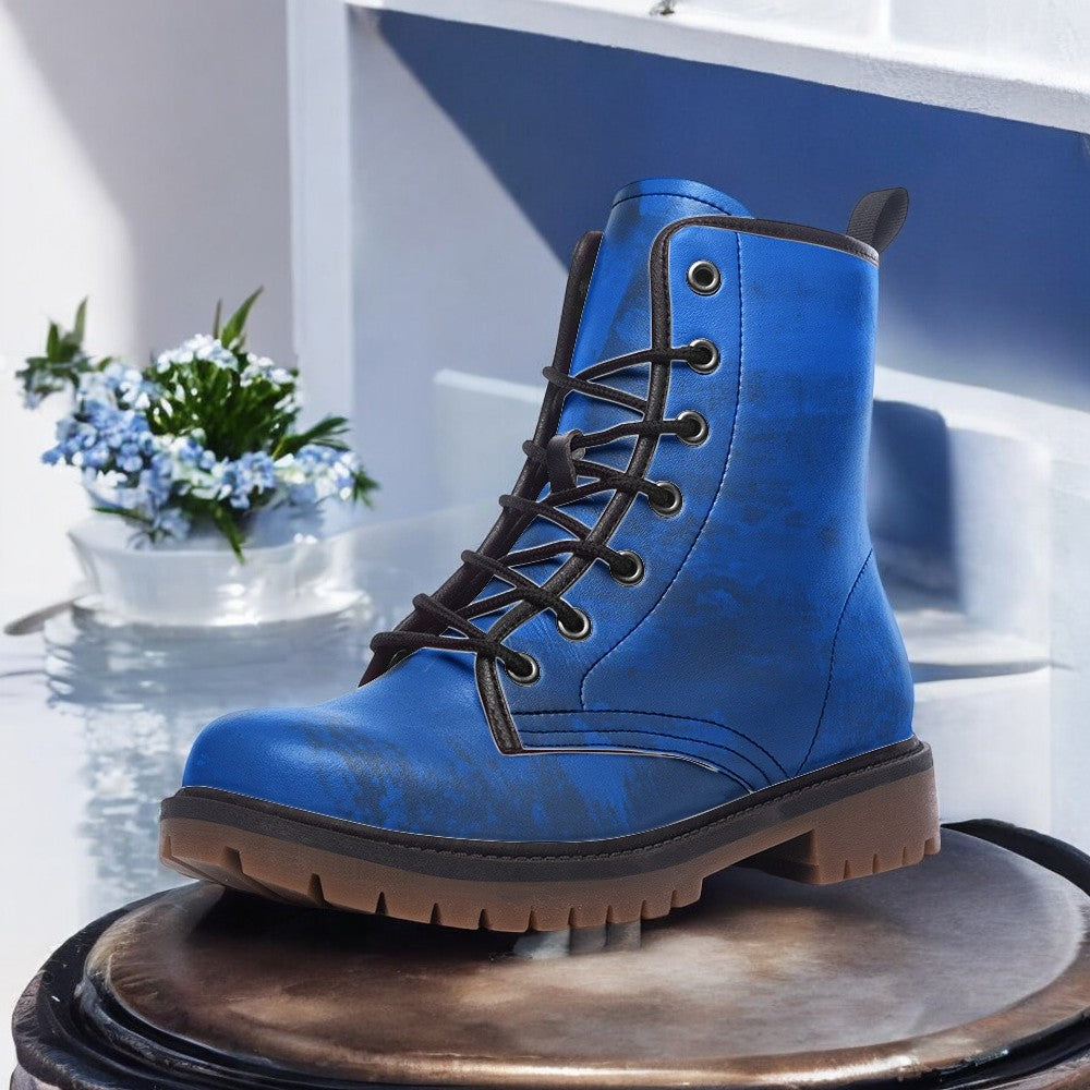 a pair of blue boots sitting on top of a table
