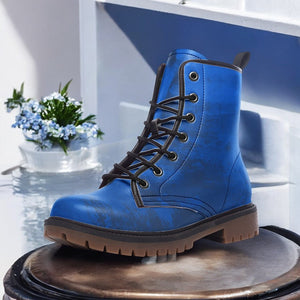 a pair of blue boots sitting on top of a table