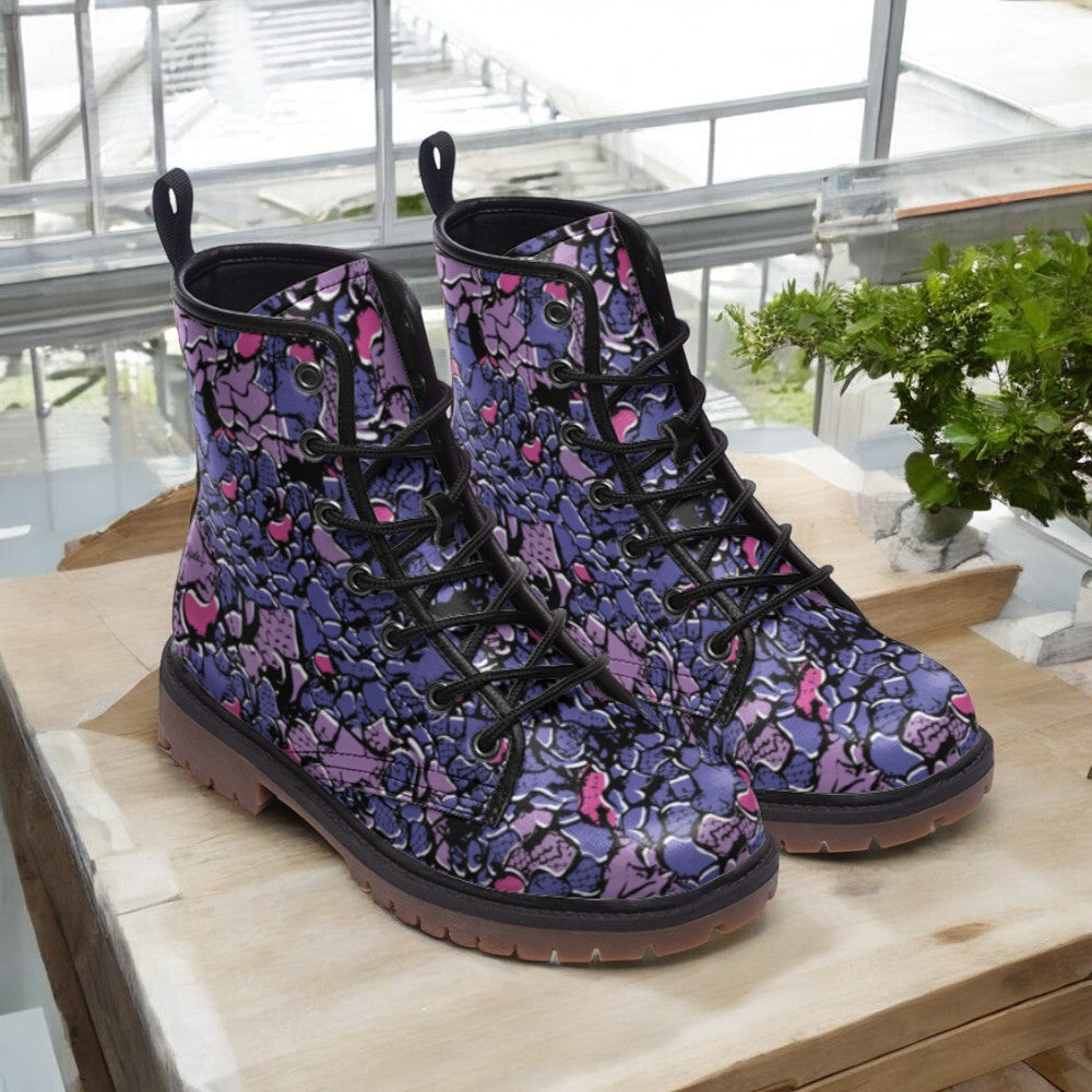 a pair of boots sitting on top of a wooden table