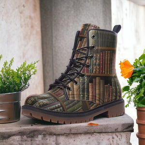 a pair of boots sitting next to a potted plant