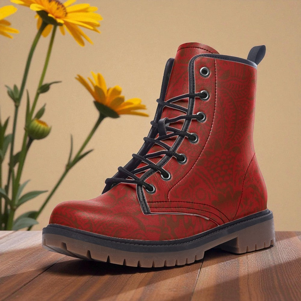 A red and black patterned boot is displayed on a wooden surface, with yellow flowers in the background.