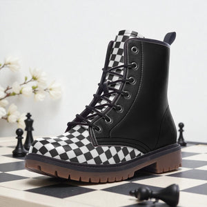 A black and white checkered boot is placed on a chessboard, with a branch of white flowers in the background.