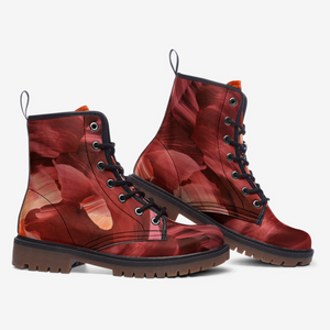 a pair of red boots with a floral pattern