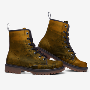 a pair of brown boots on a white background