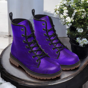 a pair of purple boots sitting on top of a table