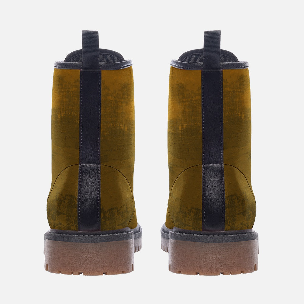 a pair of yellow and black boots on a white background