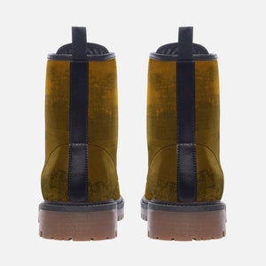 a pair of yellow and black boots on a white background