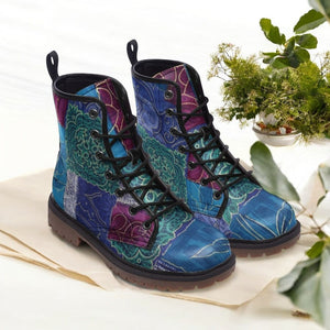 a pair of colorful boots sitting on top of a table