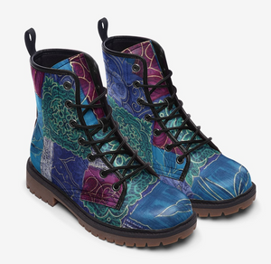 a pair of boots with a colorful design on them