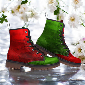 A pair of red and green combat boots with a textured appearance, placed against a background of white flowers.