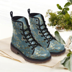 a pair of blue boots sitting on top of a table