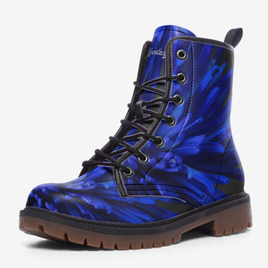 a pair of blue and black boots on a white background